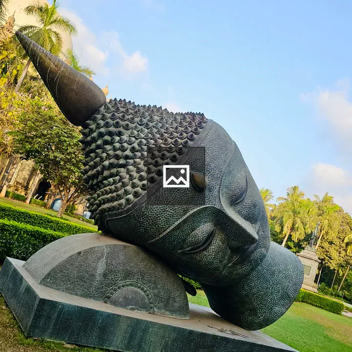 Buddha Head Sculpture among greenery