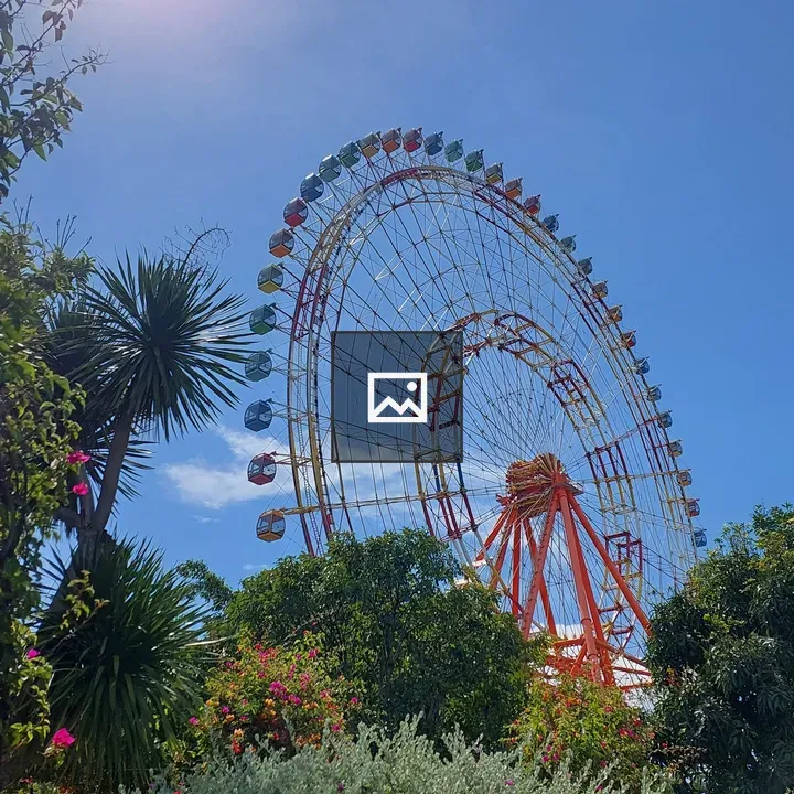 Ferris wheel against blue sky