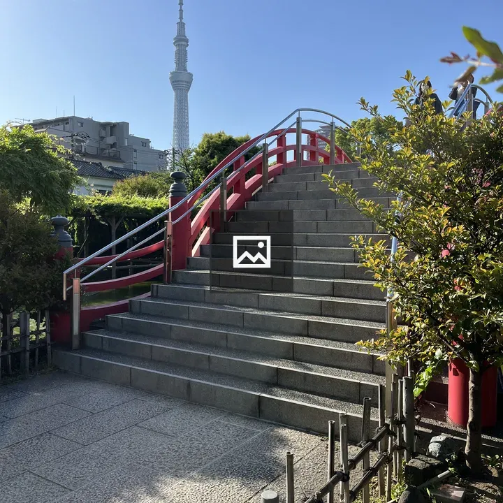 Stone stairway with red railings