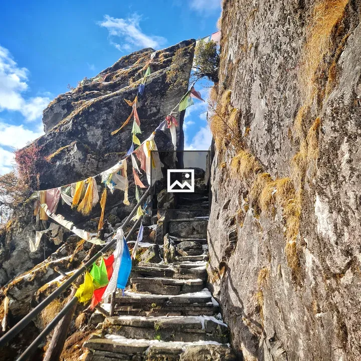 Narrow Mountain Path with Snowy Steps