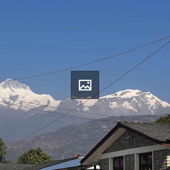 Snowy mountain scene with stone building
