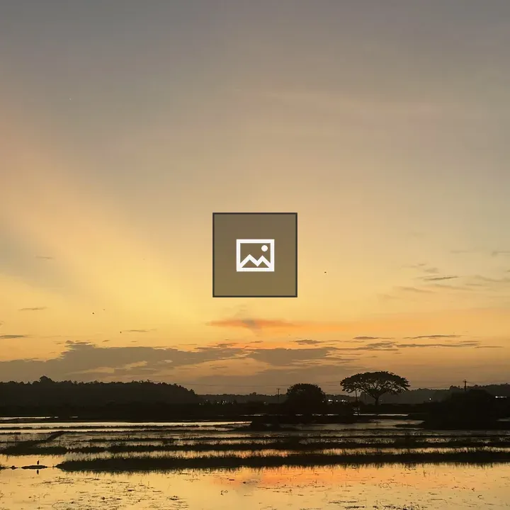 Sunset over blue and yellow water