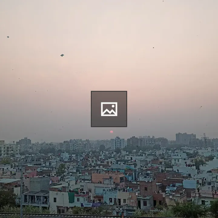 Cityscape at Sunset with Kites