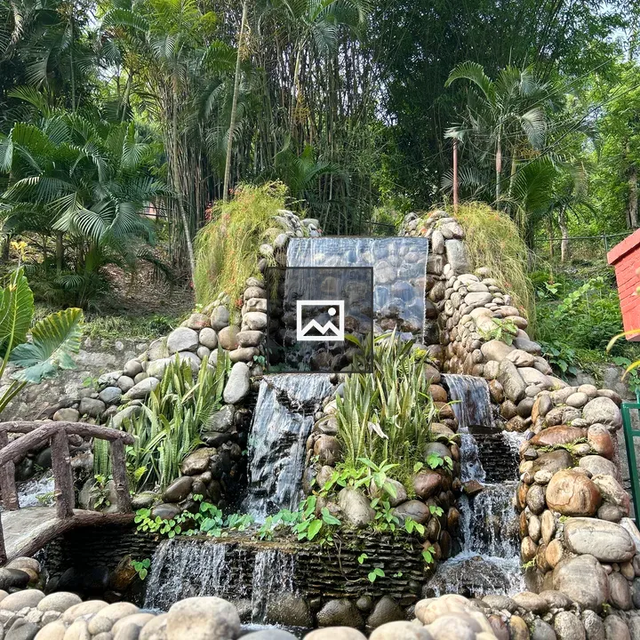 Serene Waterfall in Greenery
