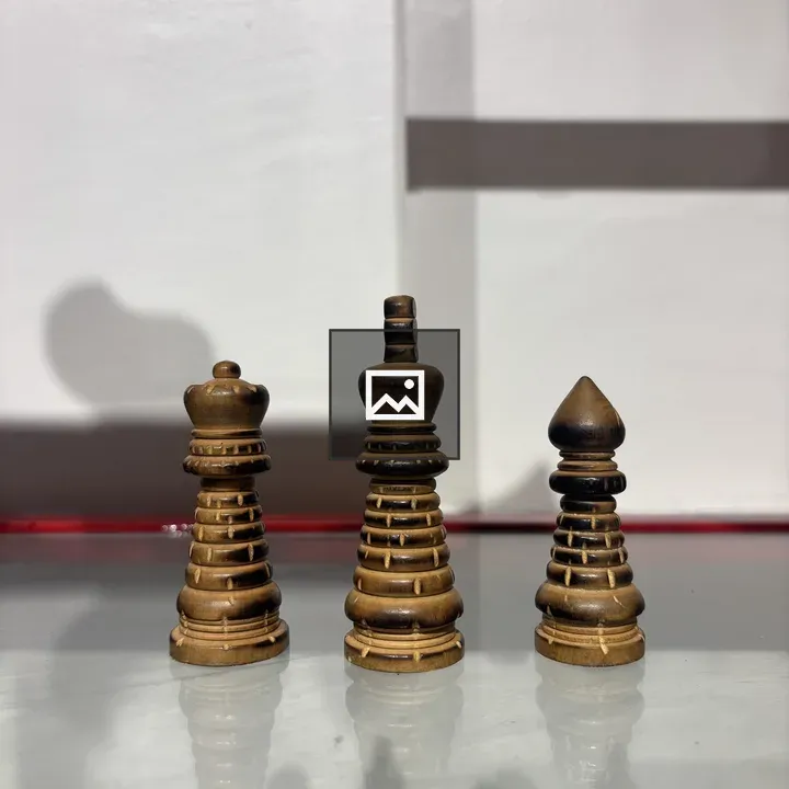 Three wooden chess pieces