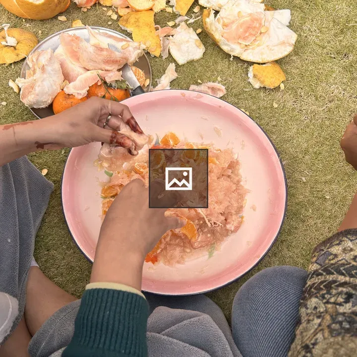Two People Preparing Citrus