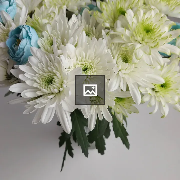 Bouquet of fabric chrysanthemums in vase