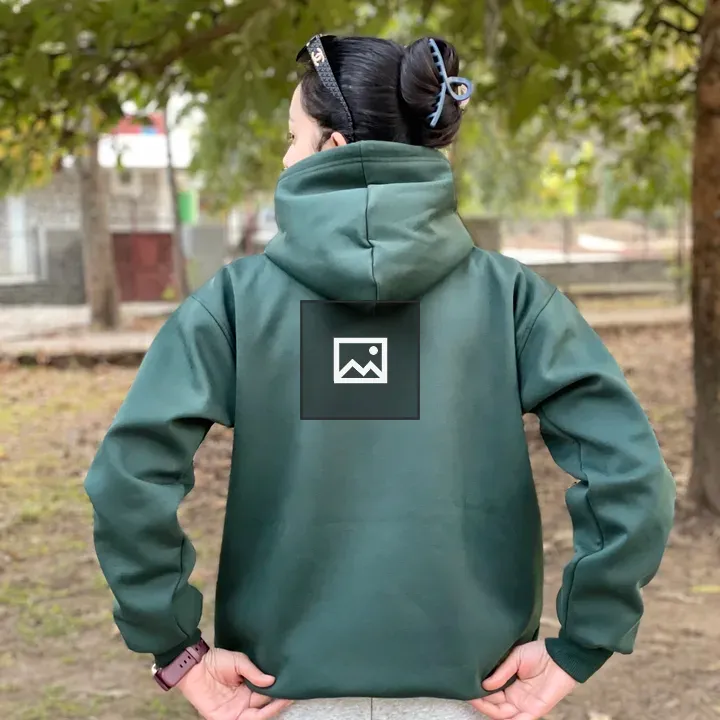 Person in green hoodie from back