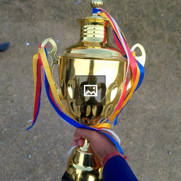 Person with gold trophy