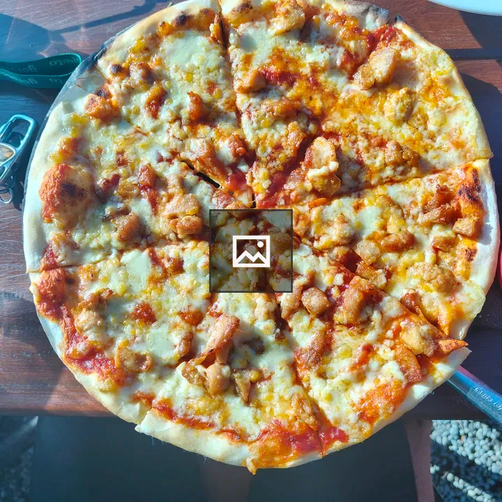Pizza on Wooden Table