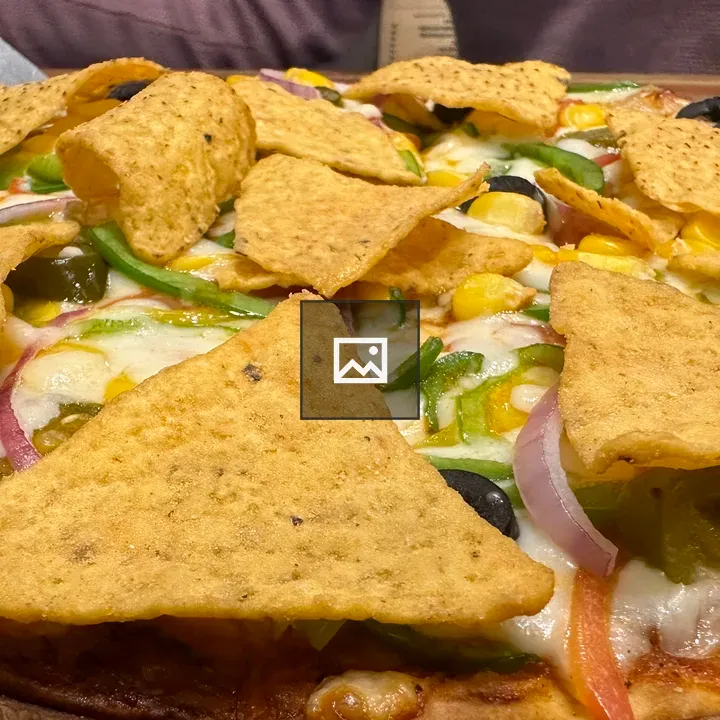 Nachos on a wooden plate