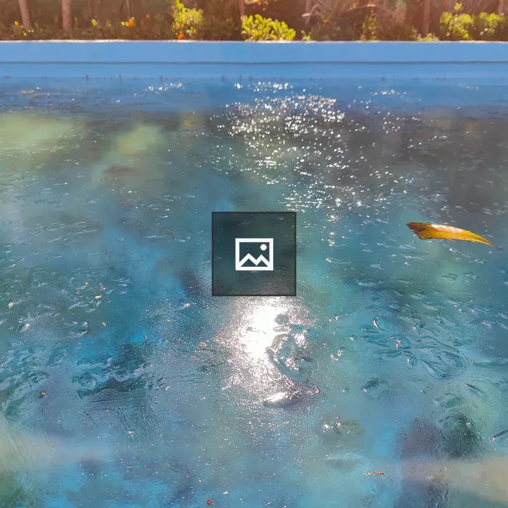Ice on blue pool surface