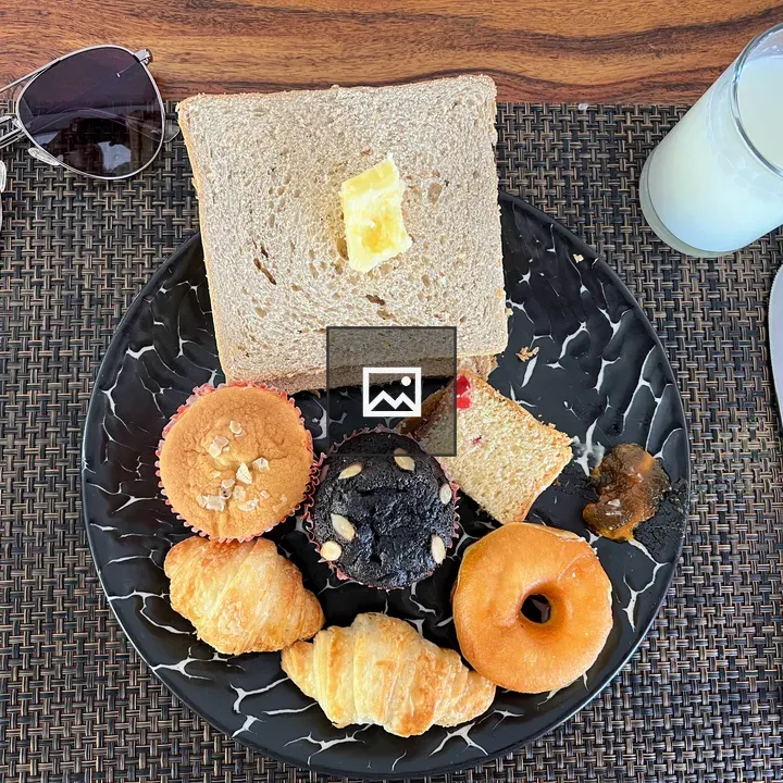 Breakfast plate with pastries and milk