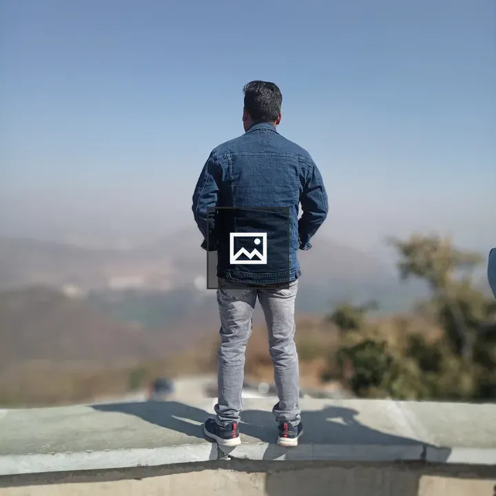 Back of a man looking over valley