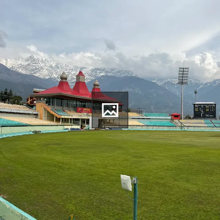 Cricket Stadium with Snowy Mountains