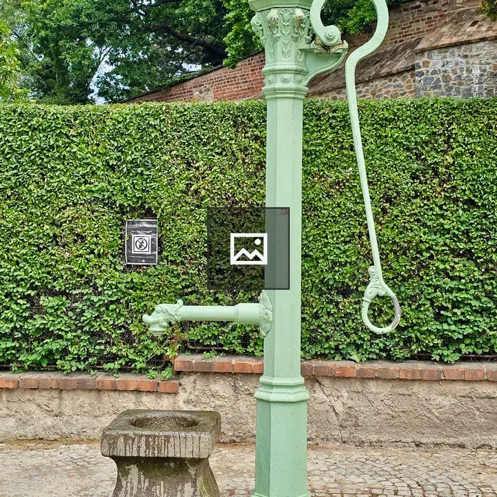 Vintage Water Pump in Garden