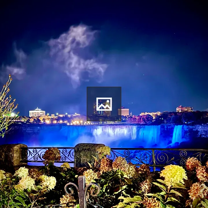 Night view of Niagara Falls with blue illumination