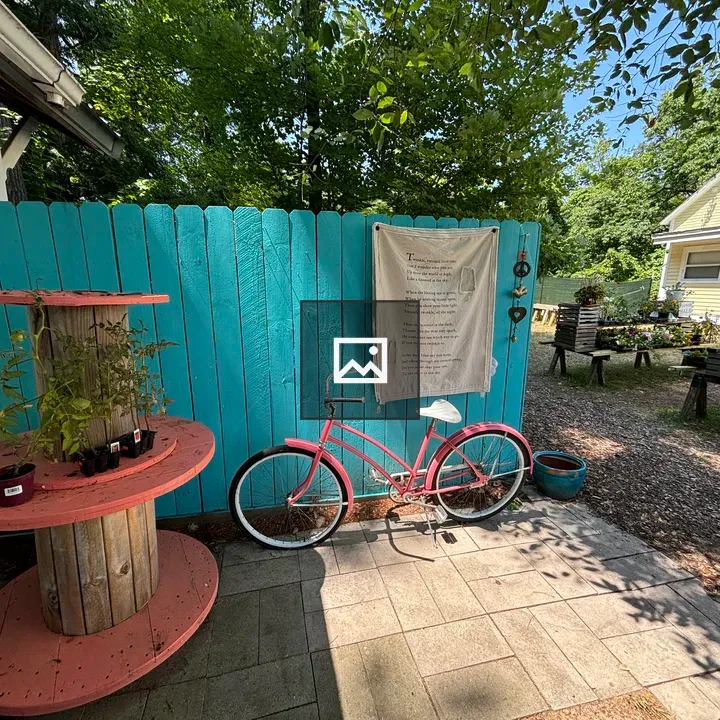Back yard pink bicycle scene