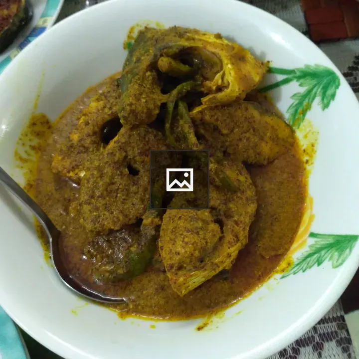 Plate of Indian curry with spoon