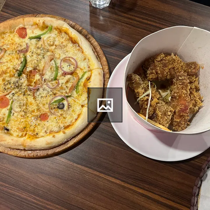 Pizza on Wooden Board with Fried Chicken