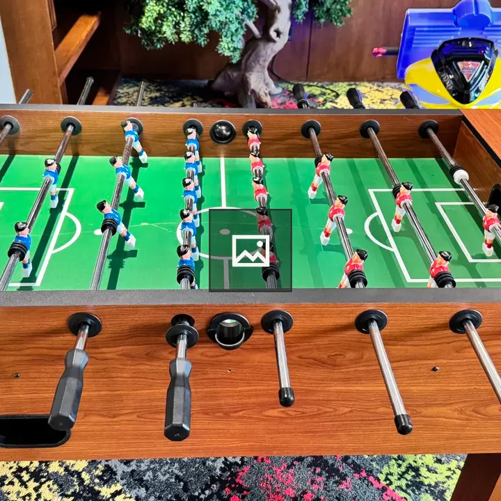 Foosball Table on Colorful Carpet
