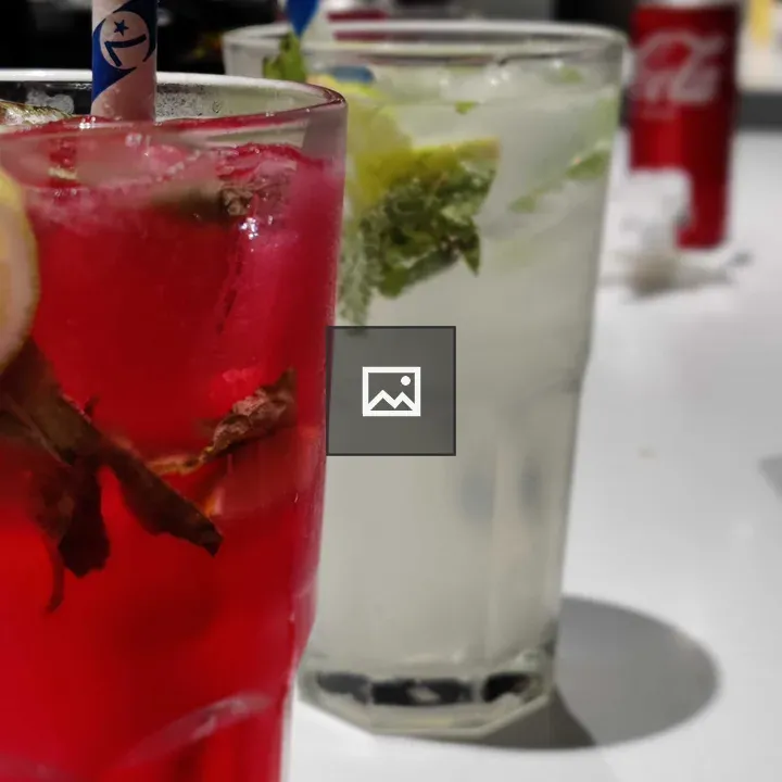 Two cocktail drinks on a table