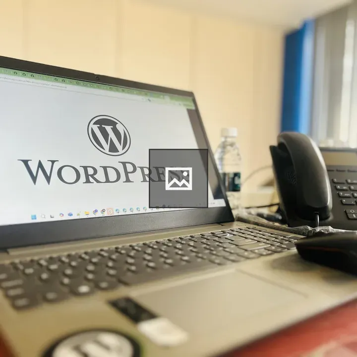 Laptop with WordPress logo on desk