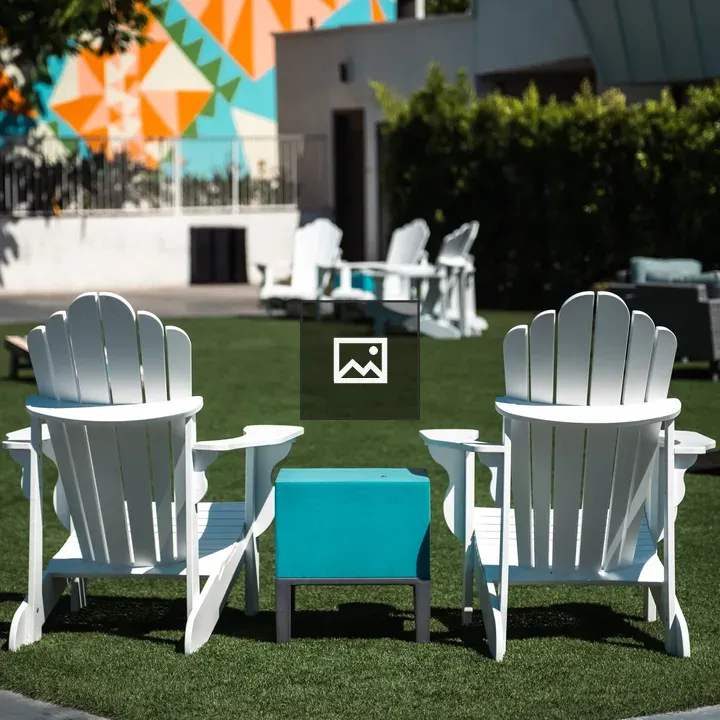 White Lawn Chairs with Blue Side Table