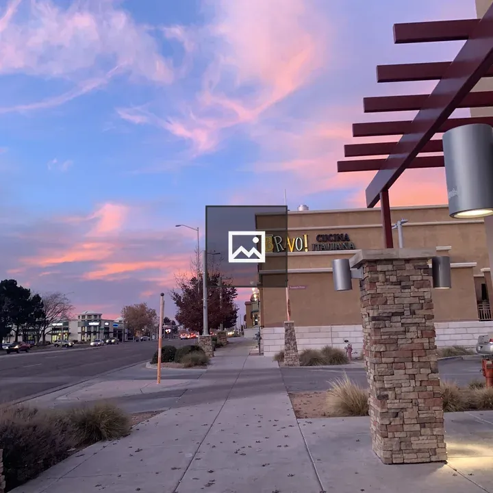 Sidewalk Scene at Sunset by Bravo! Theater