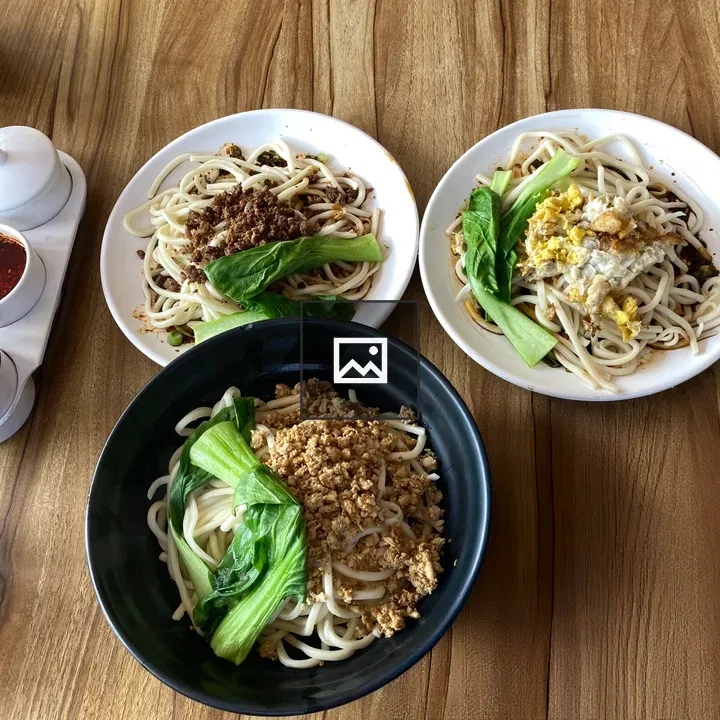 Three plates of noodles