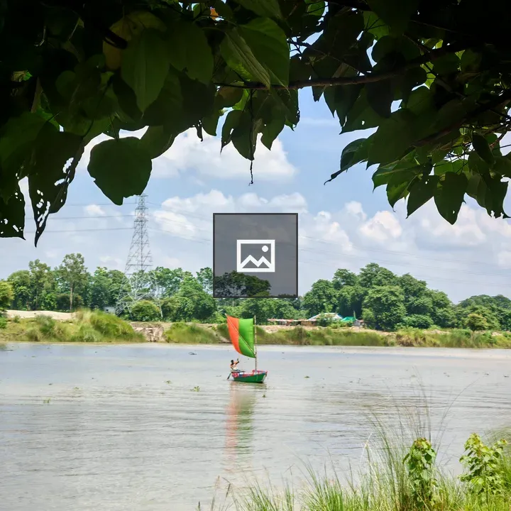 Boat with Red and Green Sail