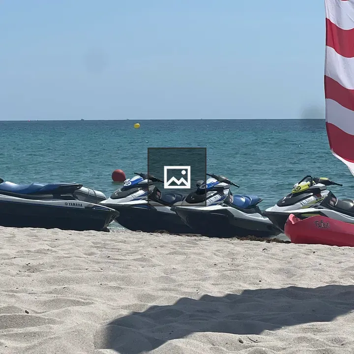 Jetskis on Beach with Flag