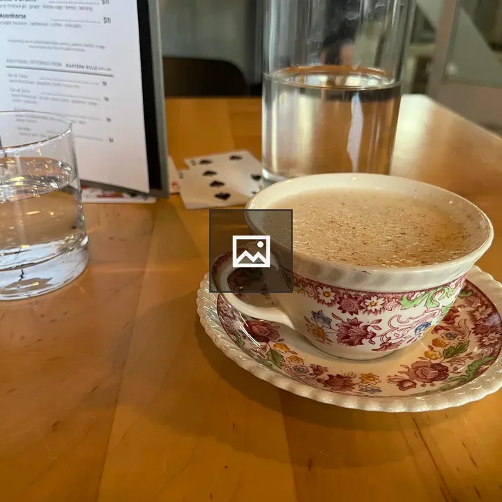 Tea-based whiskey cocktail in teacup