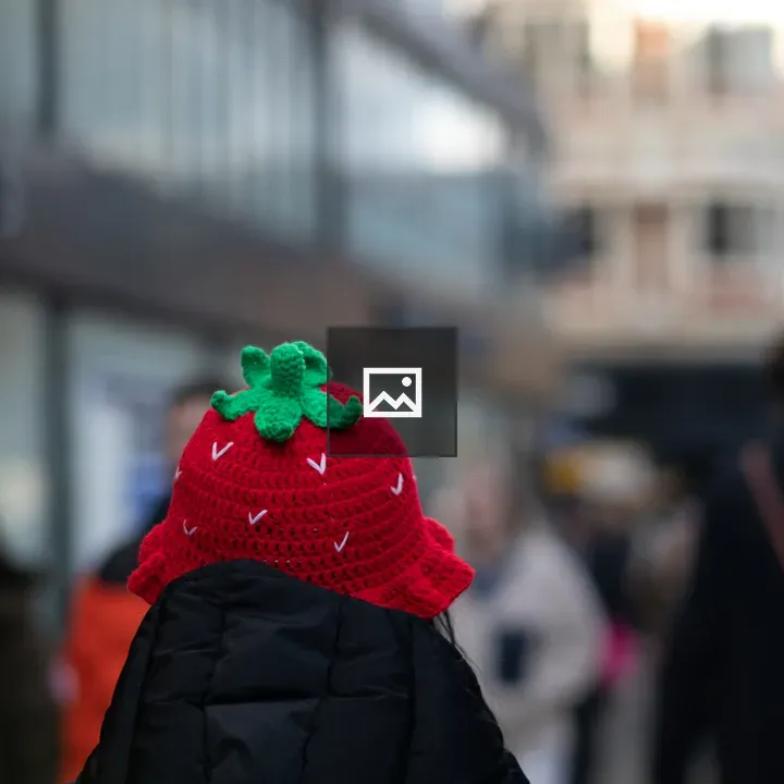Red woollen hat with strawberry