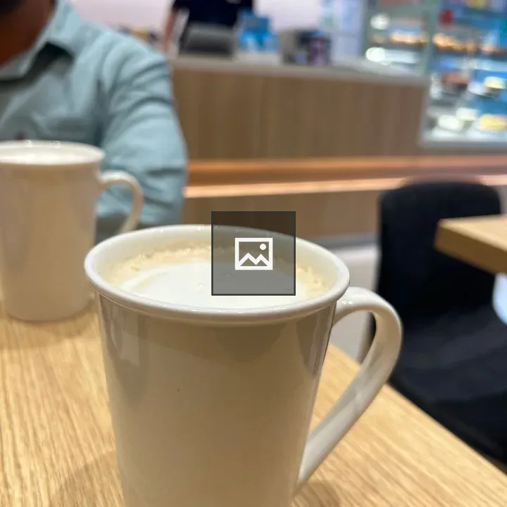 White coffee mug on wooden table