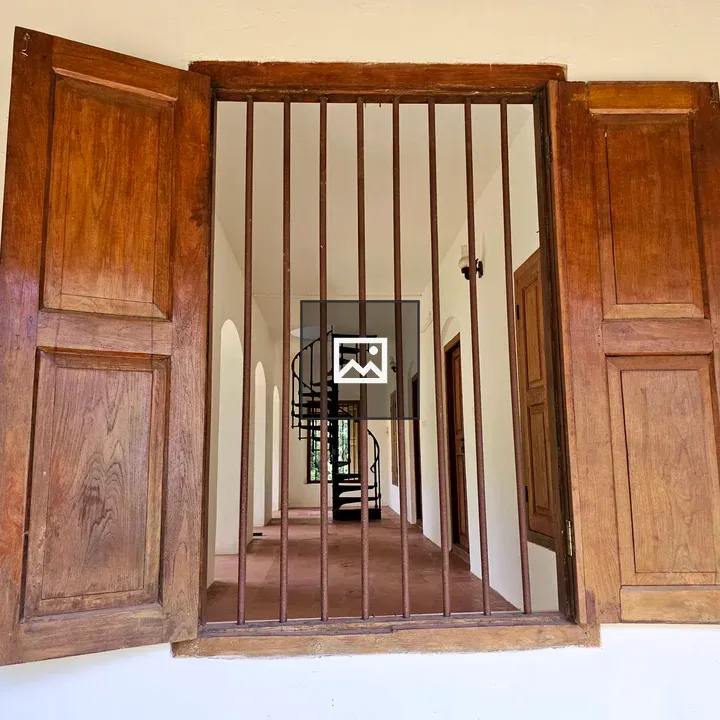 Wooden window with iron bars