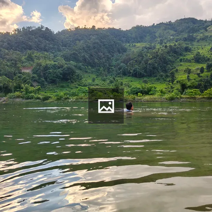 Person swimming in calm water