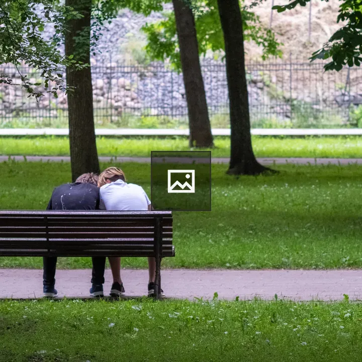Young couple on park bench