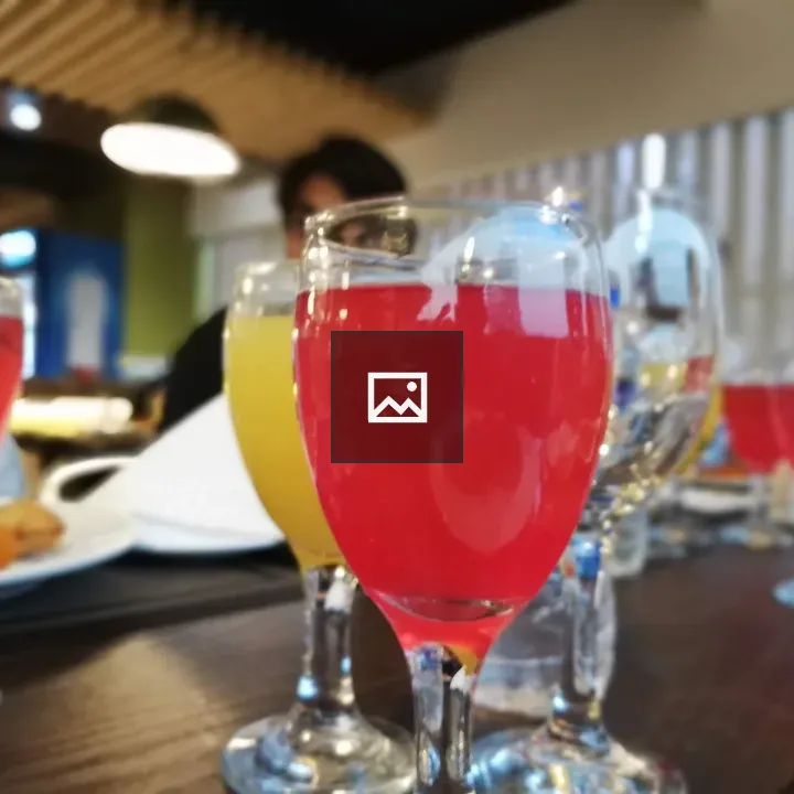 Brightly colored juices in stemware