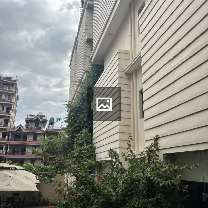 Exterior Facade with Green Foliage