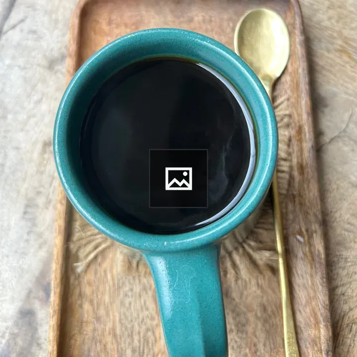 Turquoise coffee cup on wooden tray