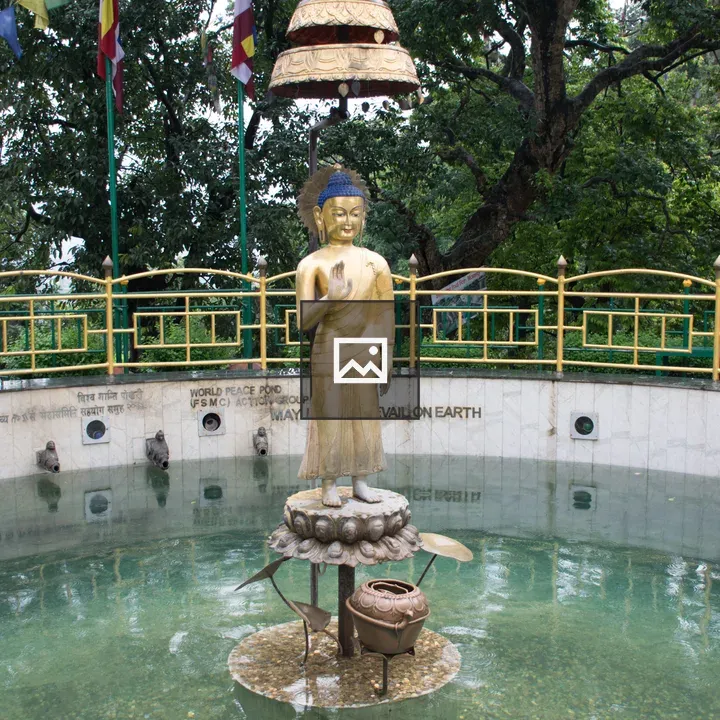 Statue of Buddha on a Small Pond