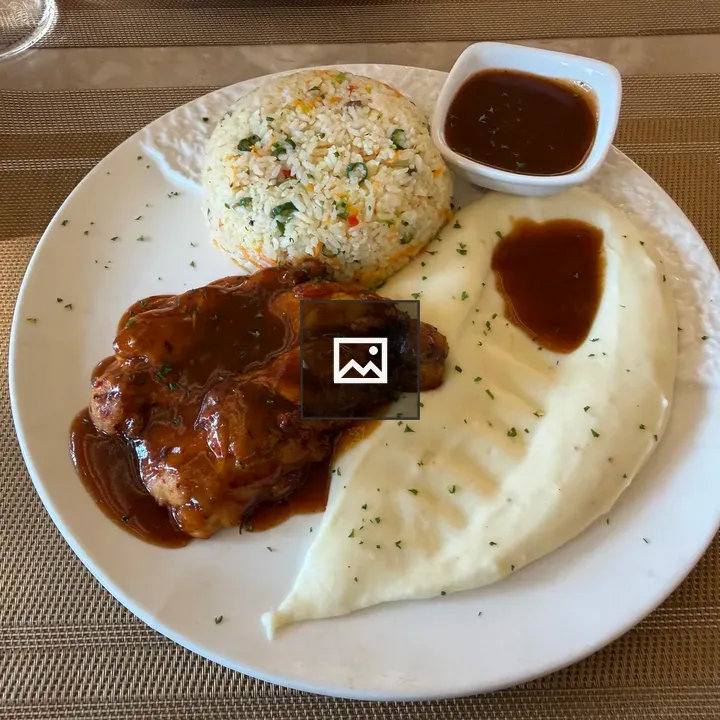 Plate of grilled chicken with rice