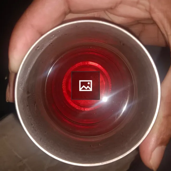 Tea in a Glass Held by Hand