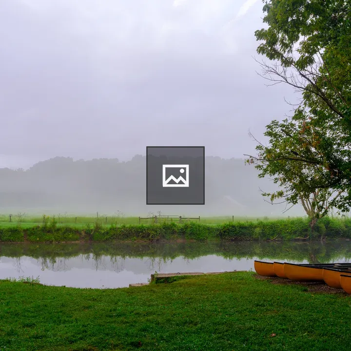 Mist and river with orange canoes