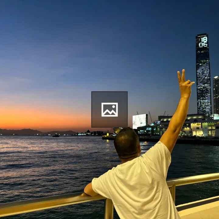 Person on bridge at dusk