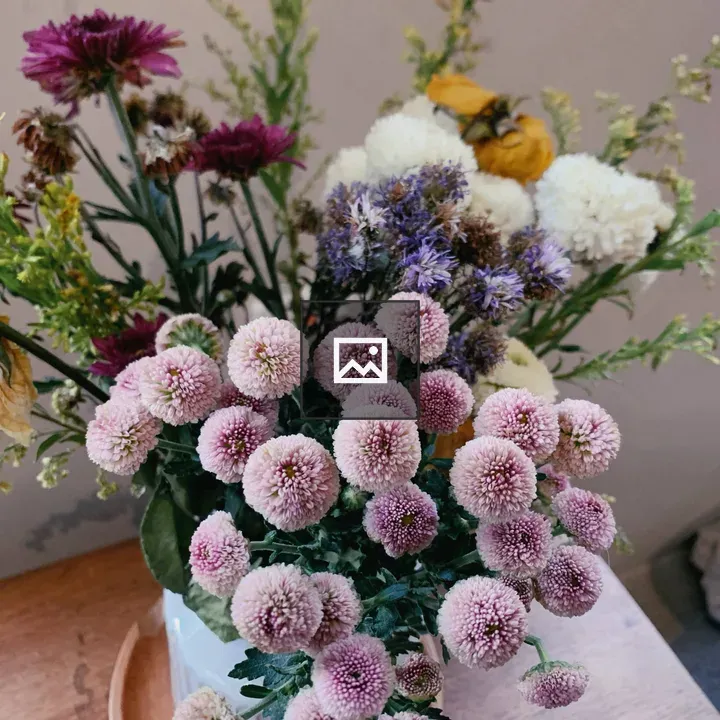 Mixed bouquet in a white vase