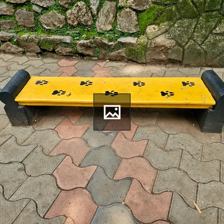Yellow bench with paw prints