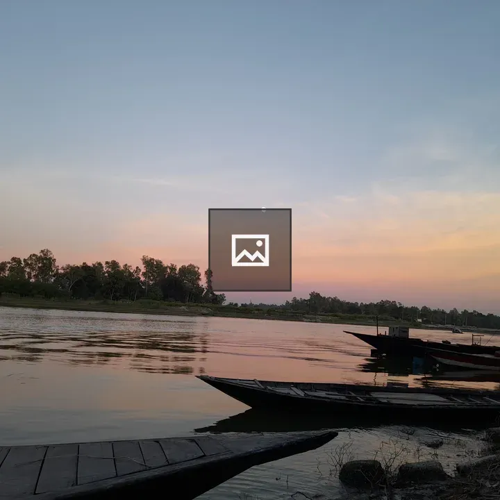 Riverside at Sunset with Boats