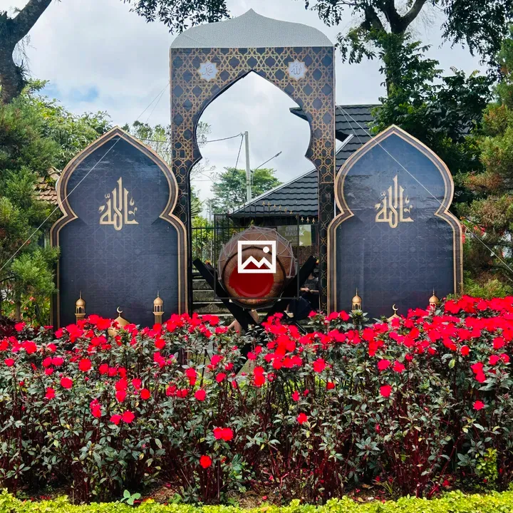 Ornate garden arch with Arabic calligraphy